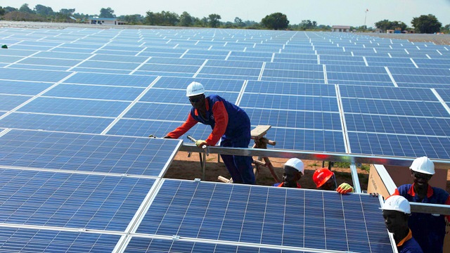 Velvet Merchants installation crew fitting a large solar array